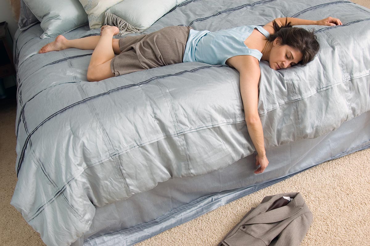 Woman sleeping comfortably on a cool mattress