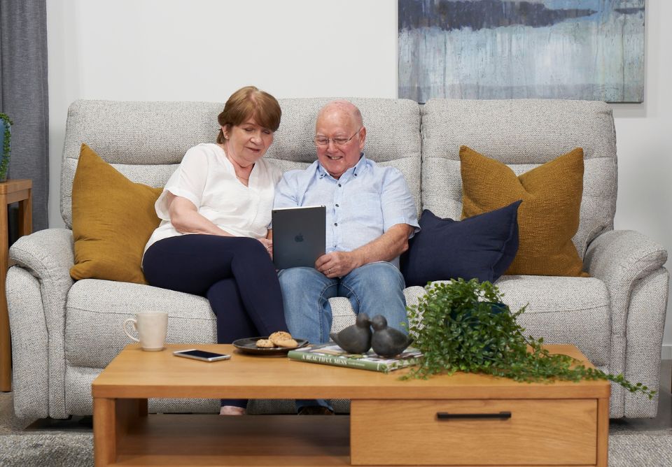 Grandparent relaxing in a La-Z-Boy recliner